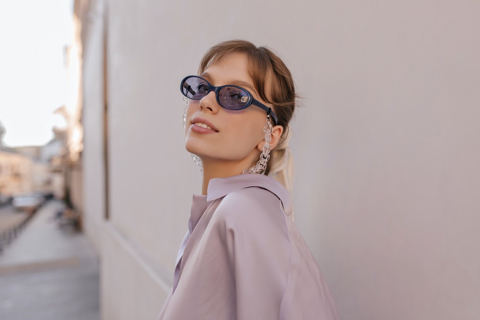 close-up-portrait-of-young-girl-in-city-pretty-brunette-wearing-silk-outfit-purple-sunglasses-wit.jpg
